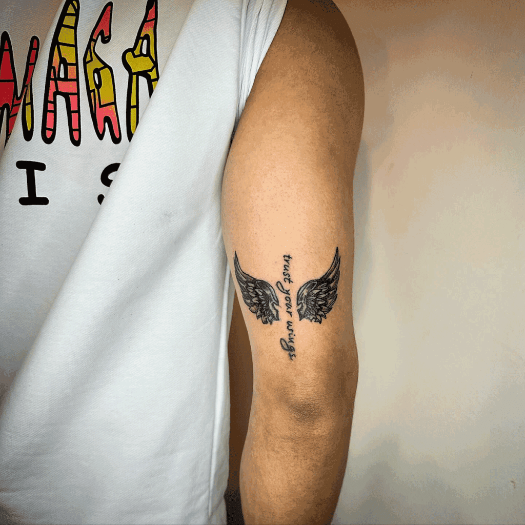 Wings Bicep Tattoo