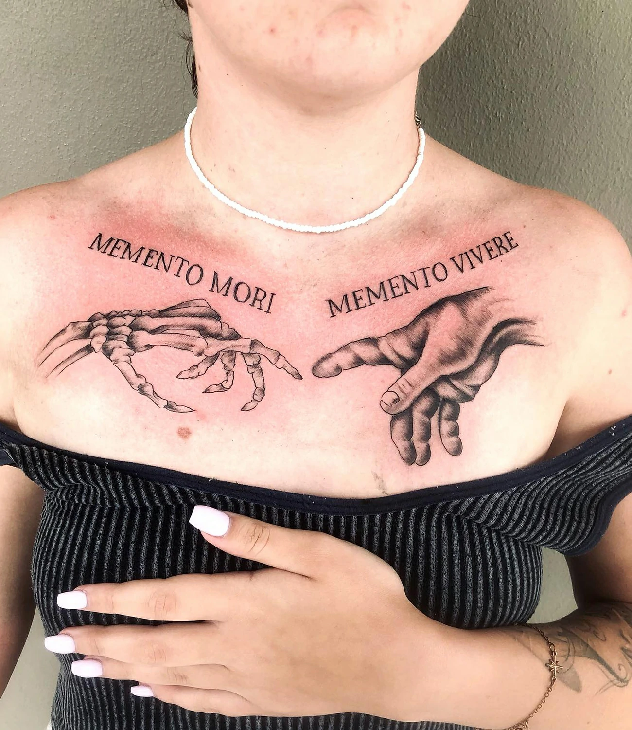memento mori chest tattoo: A large, detailed "memento mori" tattoo designed for the chest area, potentially incorporating multiple elements like skulls, clocks, or roses.