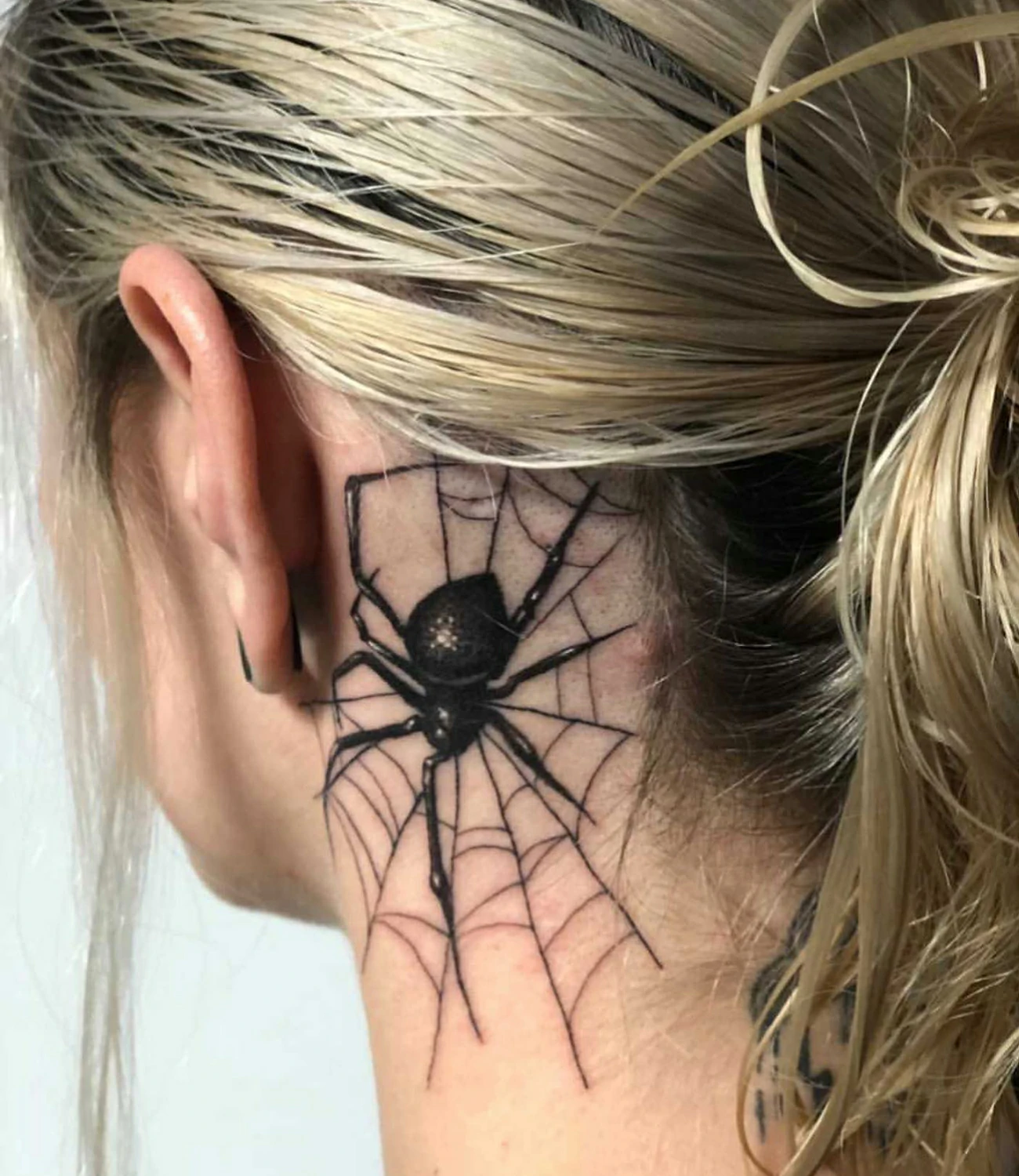 spider neck tattoo