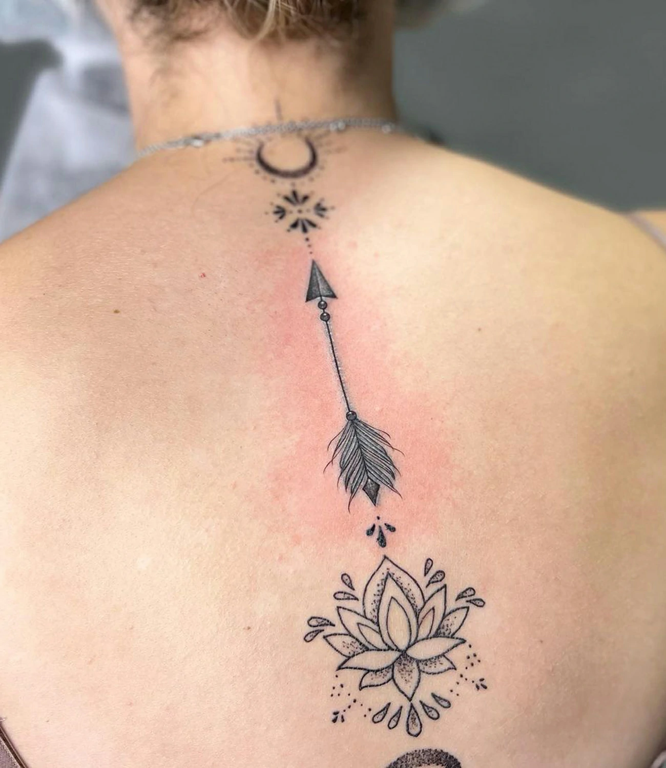 Elegant Female Arrow Tattoo