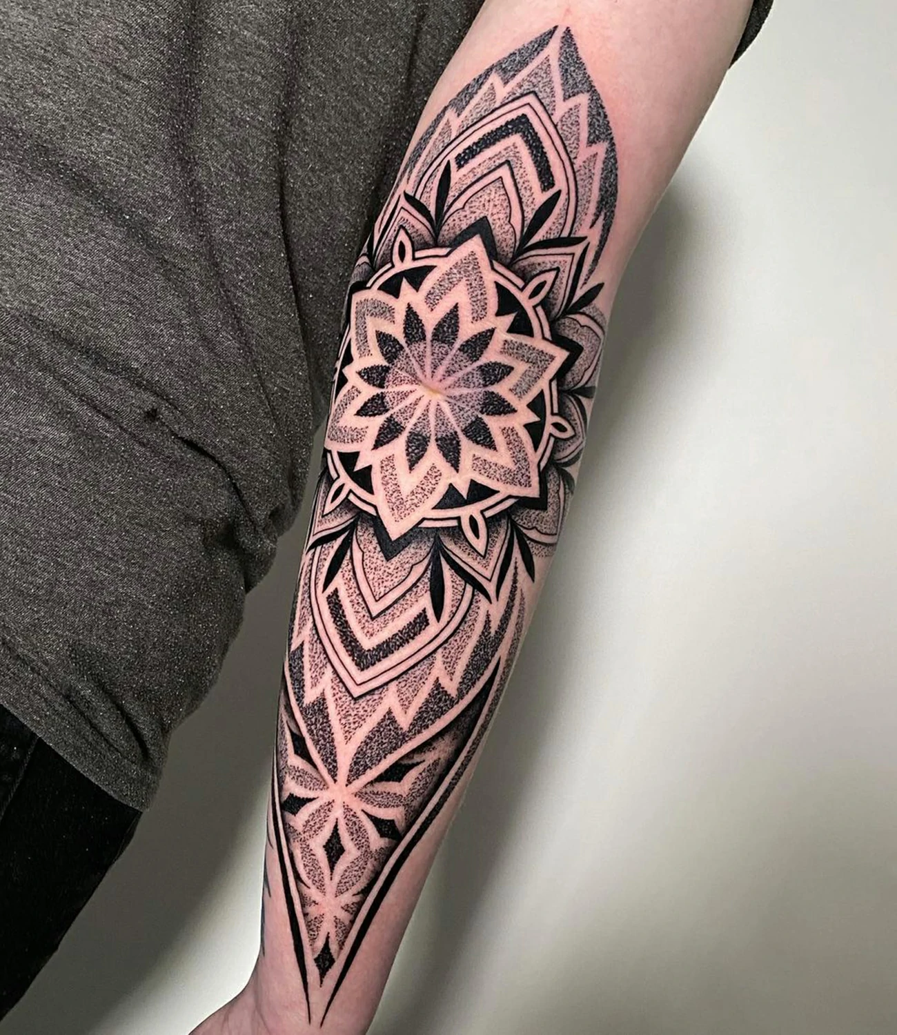 geometric elbow tattoo