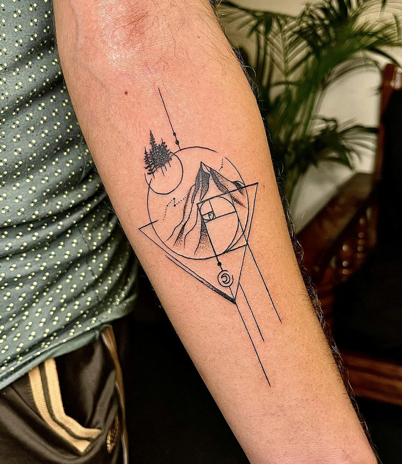Geometric Mountain Tattoos: Geometric mountain tattoos depict mountain ranges using geometric shapes, symbolizing strength and stability.