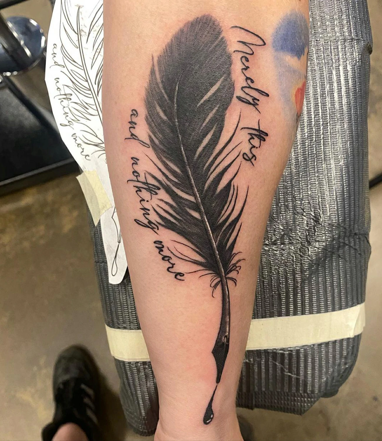 Raven feather tattoo: A design focusing on the intricate detail of a raven feather.