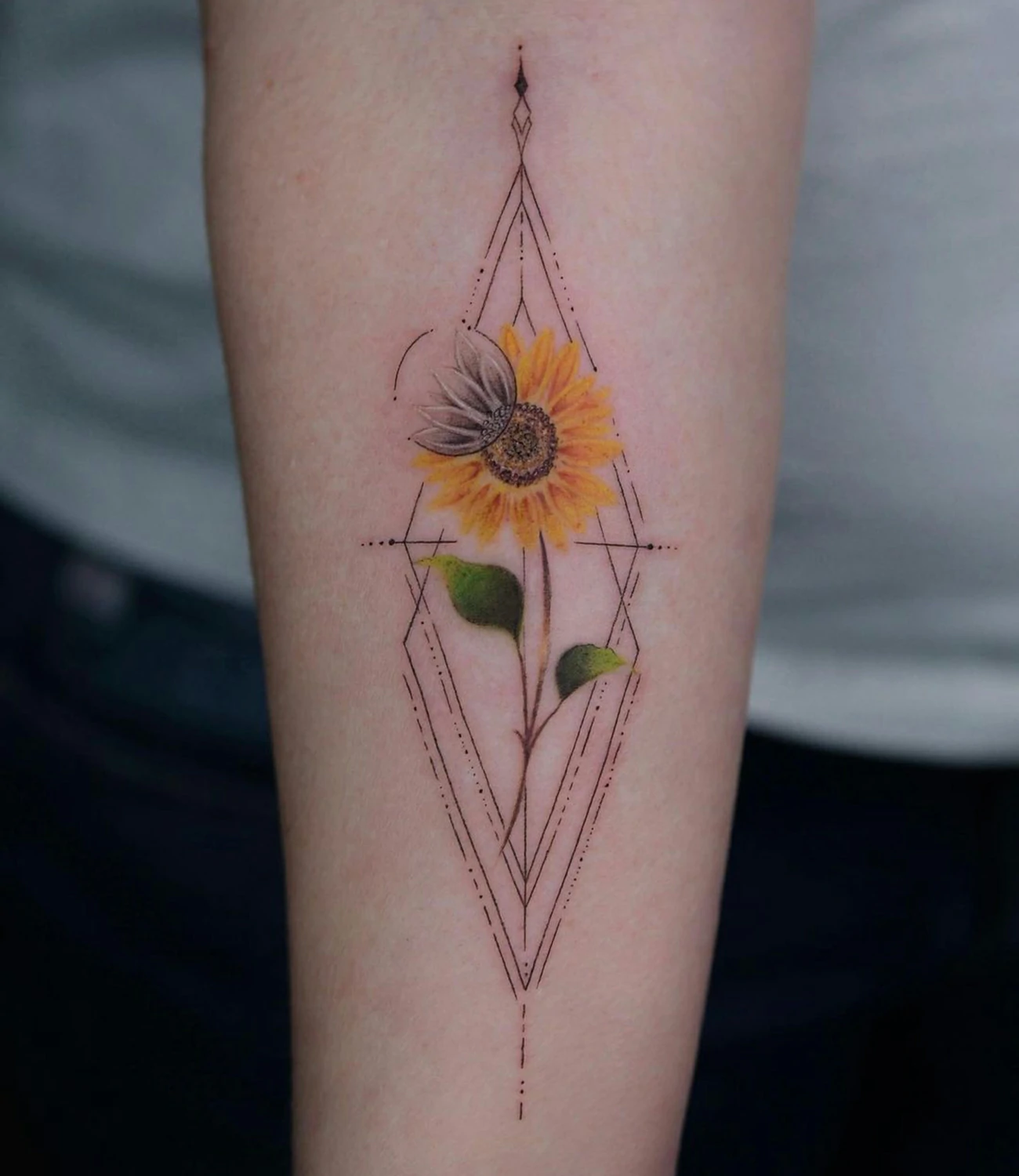 geometric sunflower tattoo