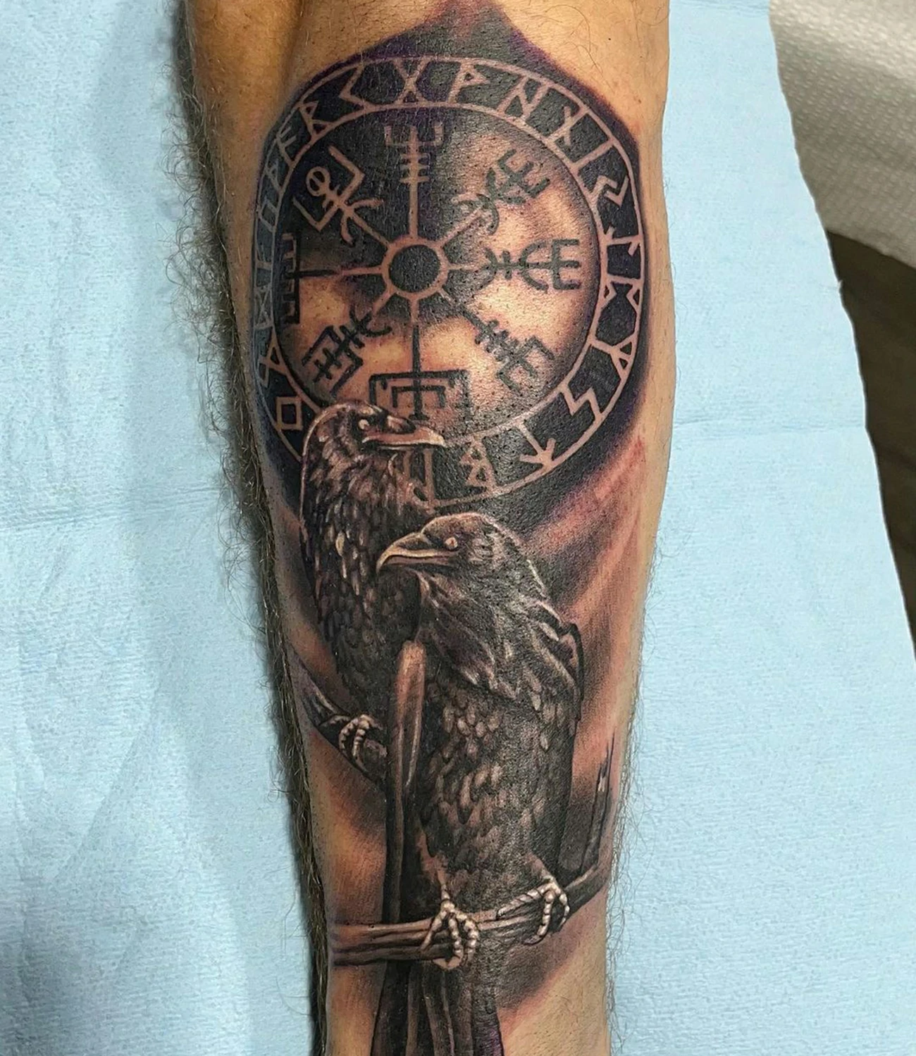 Viking raven tattoo: A raven tattoo featuring elements from Viking culture and symbolism.