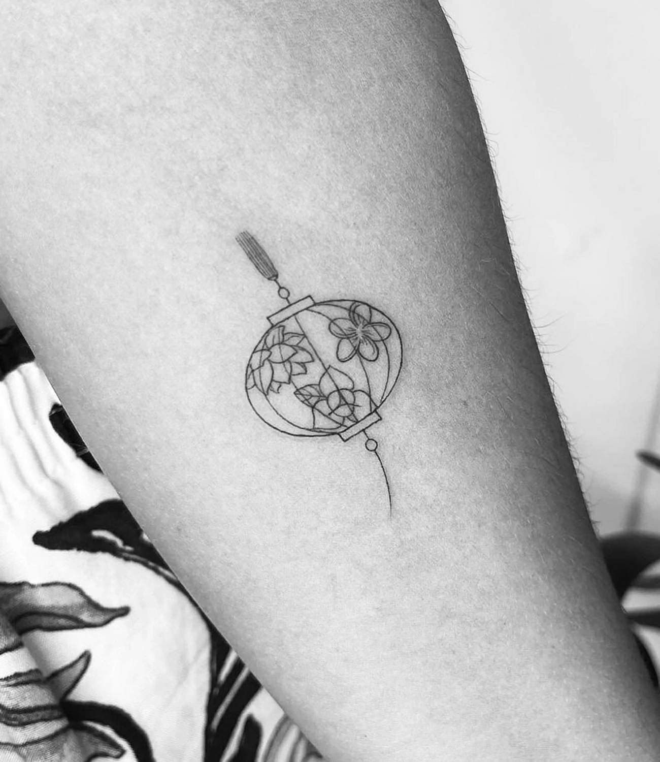 Geometric Minimal Tattoo: Geometric minimal tattoos focus on simplicity, using basic shapes to create understated yet meaningful designs.