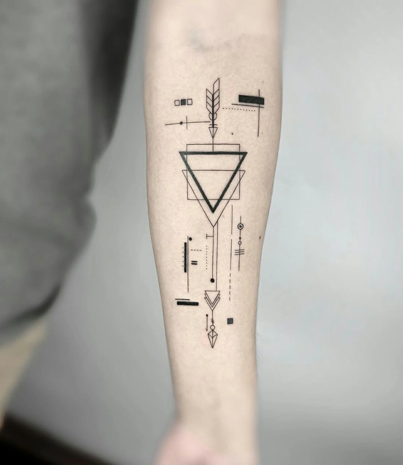 geometric arrow tattoo