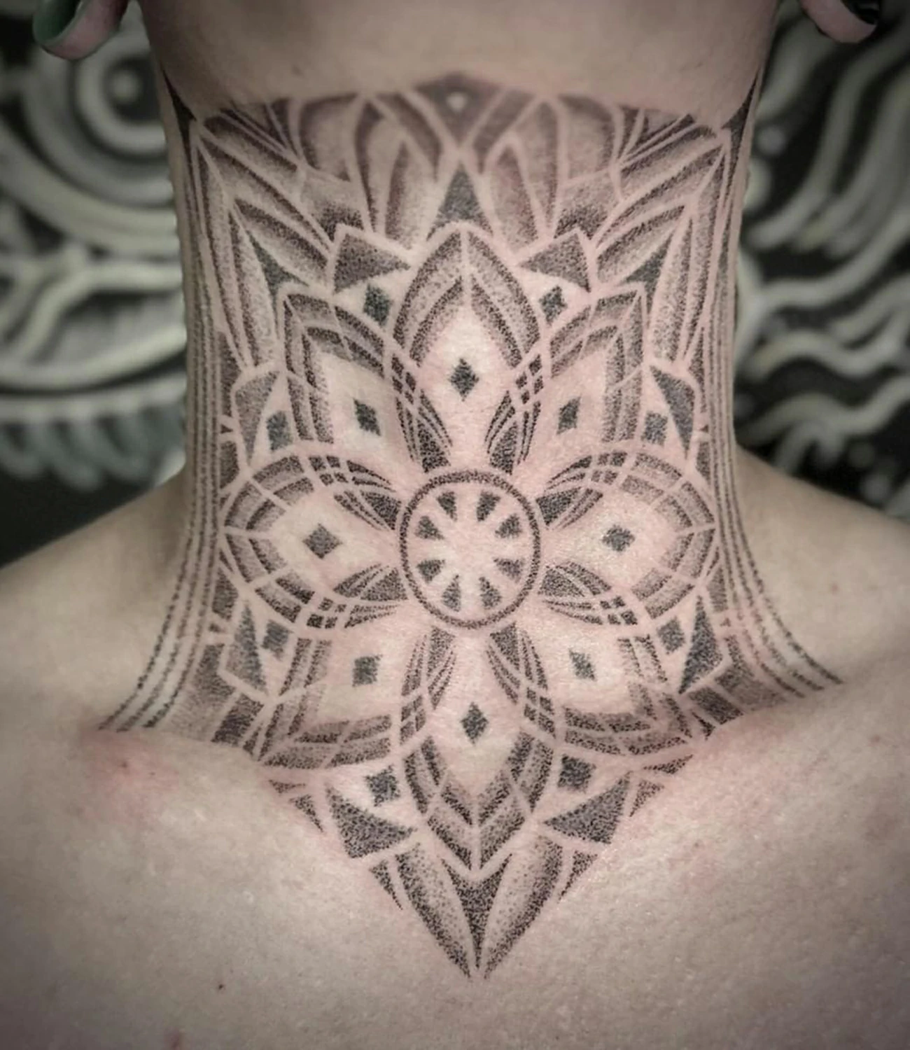 geometric throat tattoo